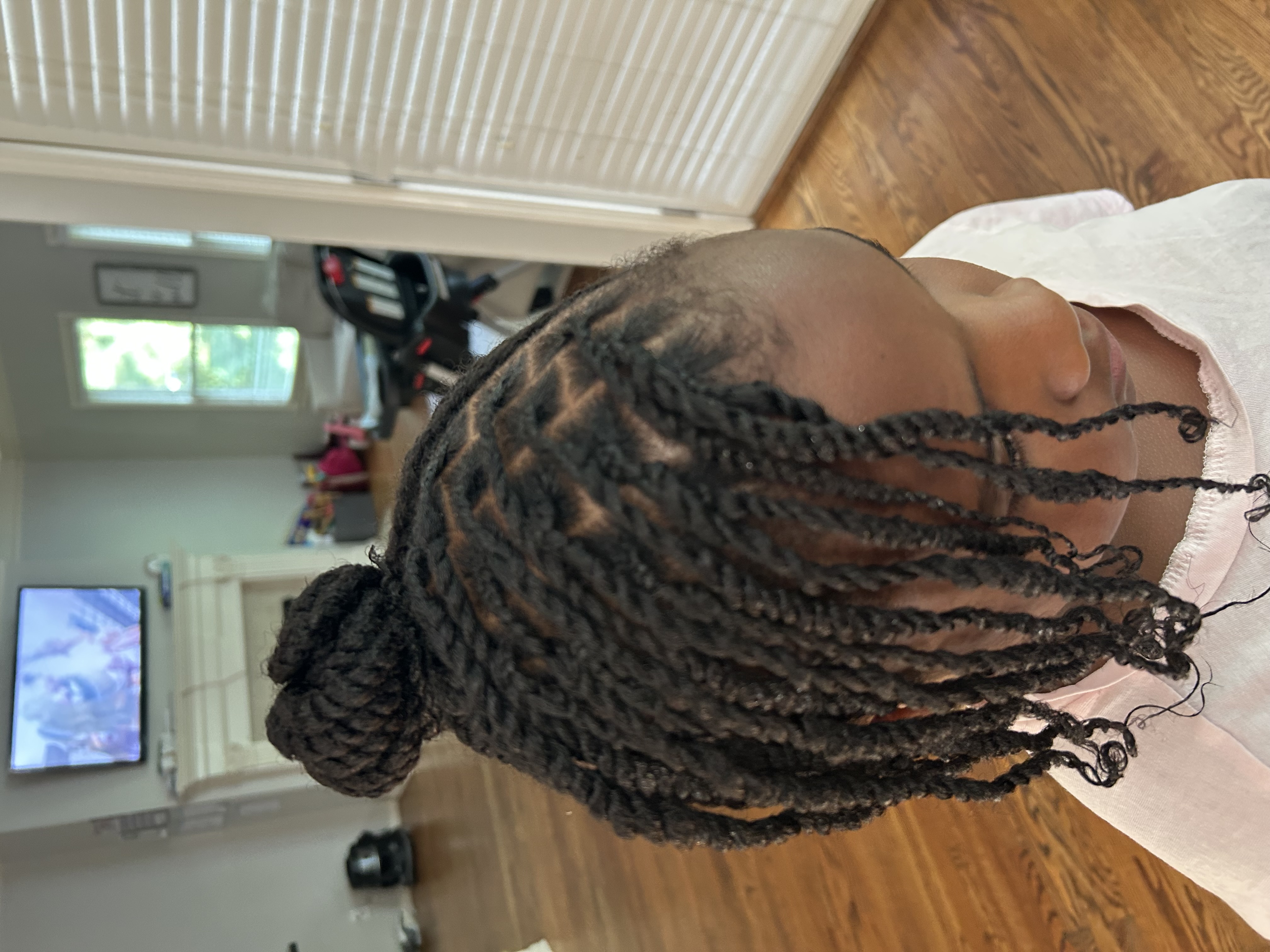 Child receiving natural hair styling